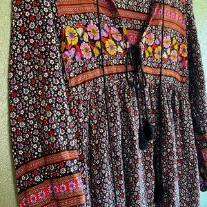 Black floral long sleeve boho maxi dress with purple and gold floral detail